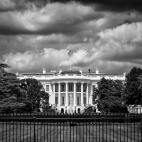 Black and white image of the White House on a cloudy day
